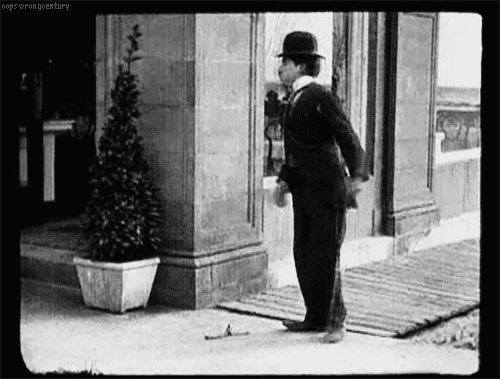 _Charlie Chaplin slips on a banana peel in_ By the Sea _(1915)._